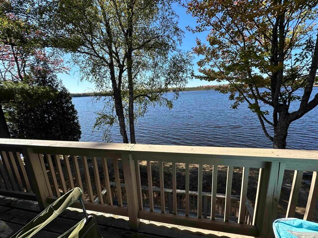 wooden deck with a water view