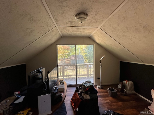 additional living space with lofted ceiling and dark wood-type flooring