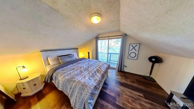 bedroom with a textured ceiling, lofted ceiling, dark hardwood / wood-style flooring, and access to exterior