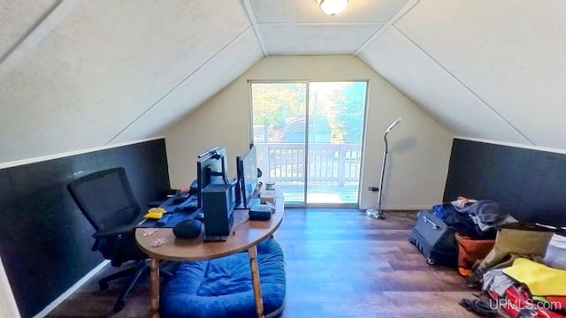 office space with wood-type flooring and vaulted ceiling