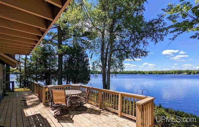 wooden deck with a water view