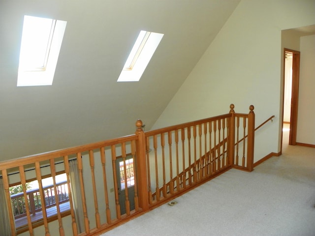 additional living space featuring carpet flooring and plenty of natural light