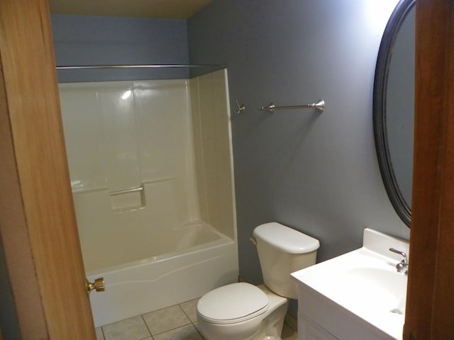 full bathroom with tile patterned floors, bathing tub / shower combination, vanity, and toilet