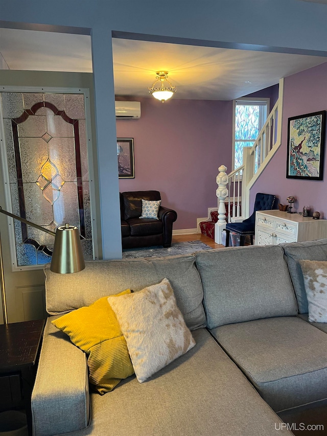 living room featuring carpet and a wall unit AC