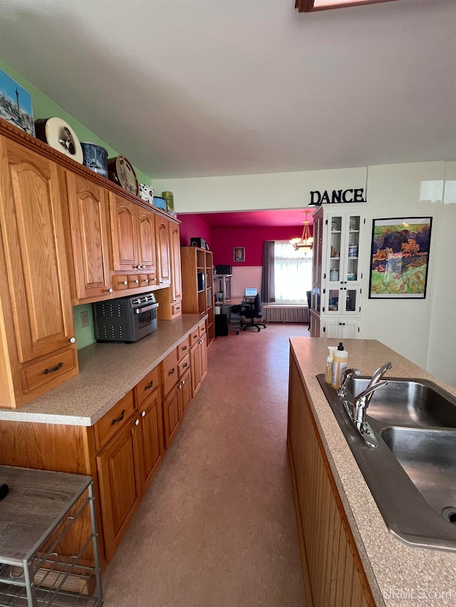 kitchen featuring sink and radiator