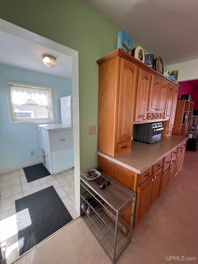 kitchen featuring light tile patterned flooring