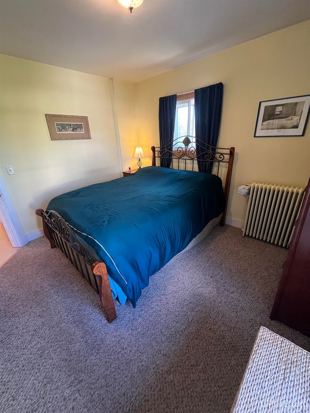 bedroom featuring carpet flooring and radiator