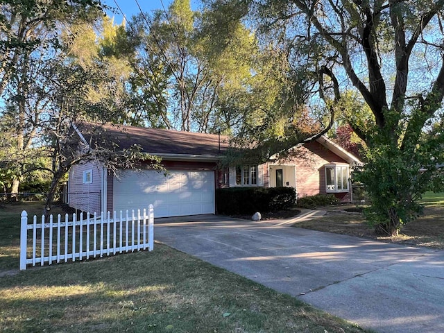 single story home featuring a front yard and a garage