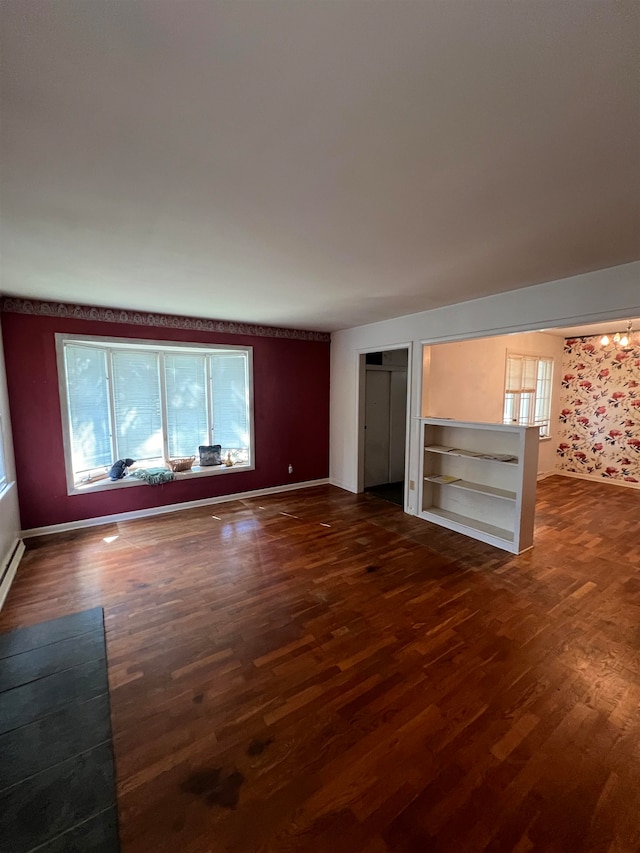 unfurnished living room featuring dark hardwood / wood-style floors