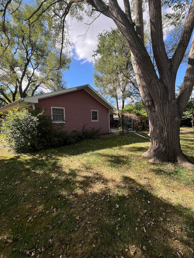 view of property exterior featuring a yard