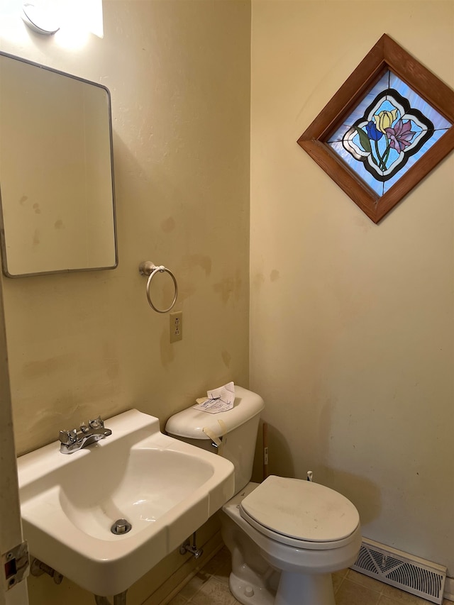 bathroom with sink, tile patterned floors, and toilet