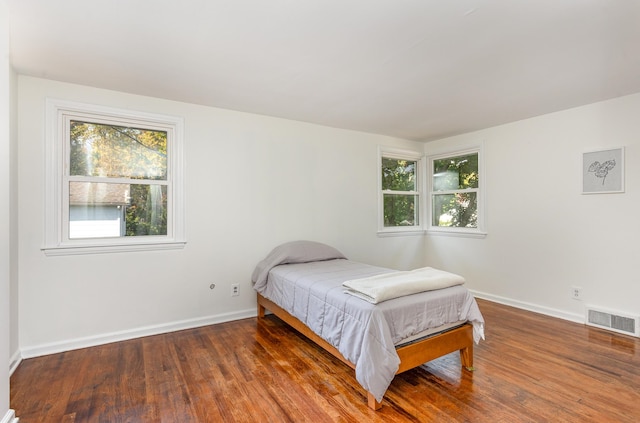 bedroom featuring dark hardwood / wood-style floors