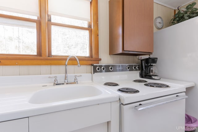 kitchen featuring white range with electric cooktop and sink