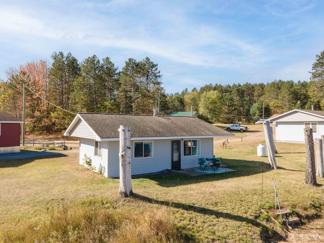 view of front of property with a front lawn and a patio area