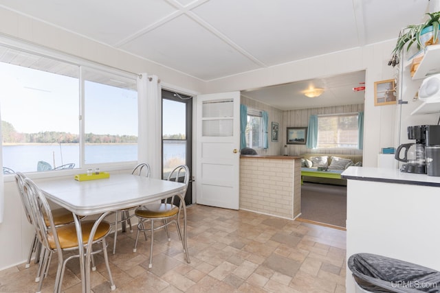 dining area featuring a water view