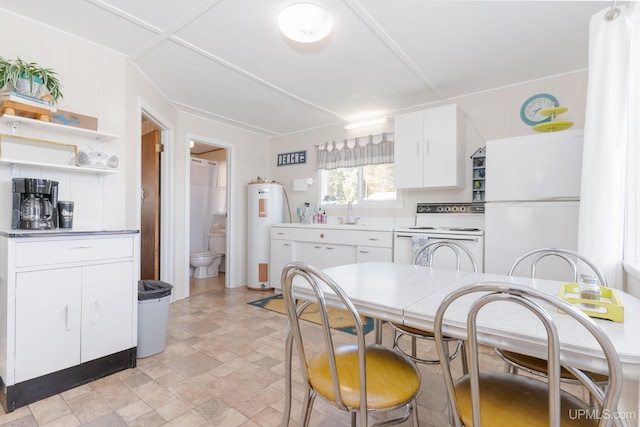 kitchen with white cabinets, white appliances, and electric water heater