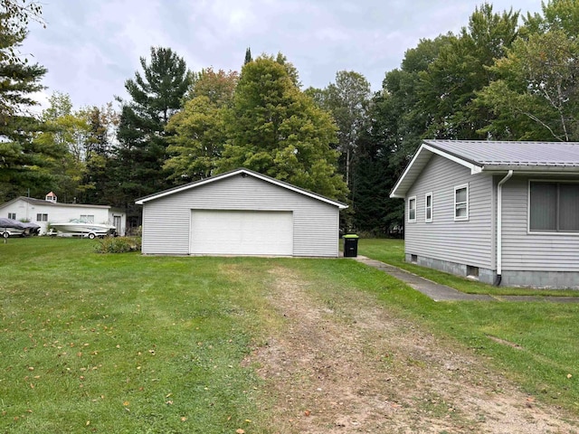 garage featuring a yard