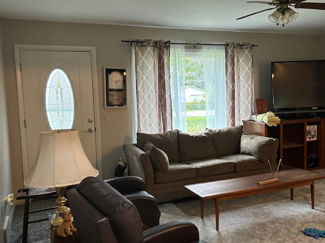 living room featuring carpet and ceiling fan