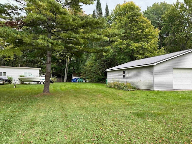 view of yard with a garage