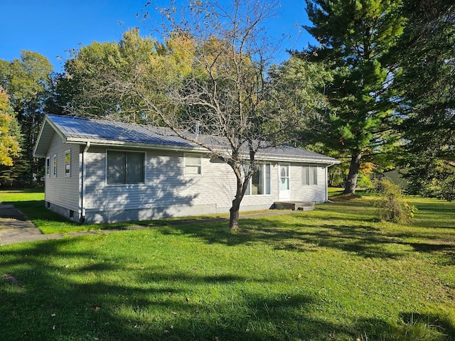 view of home's exterior featuring a lawn