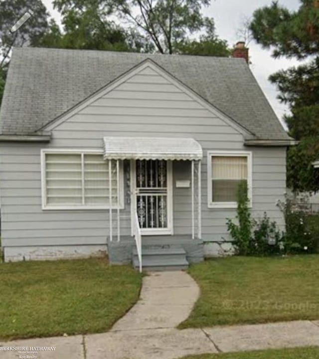 bungalow with a front lawn