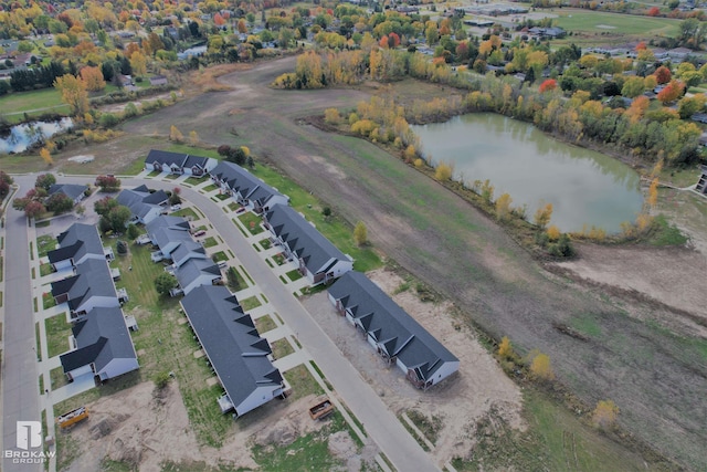 drone / aerial view with a residential view and a water view