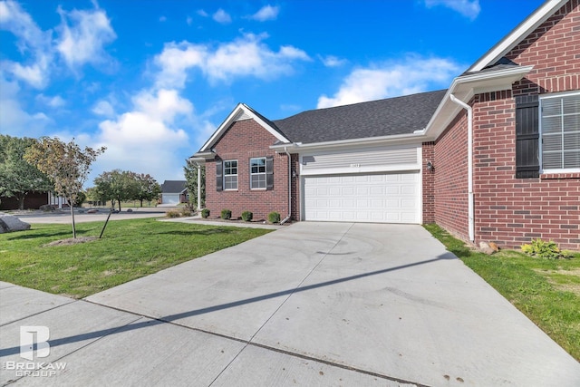 ranch-style home with an attached garage, brick siding, concrete driveway, and a front yard