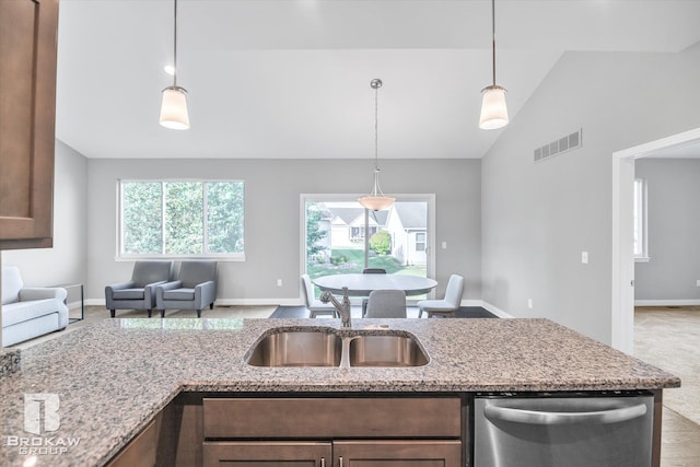 kitchen featuring sink, a wealth of natural light, lofted ceiling, and stainless steel dishwasher