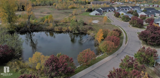 birds eye view of property featuring a water view