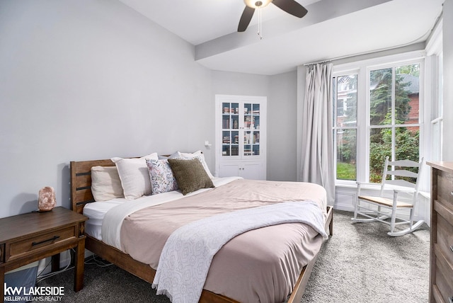 carpeted bedroom with multiple windows and ceiling fan