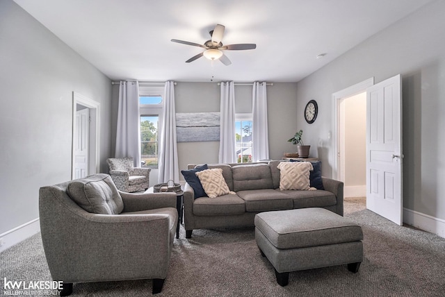 living room with ceiling fan and carpet floors