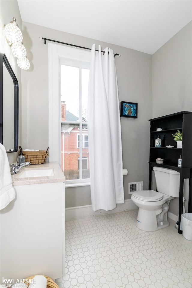 bathroom with vanity and toilet