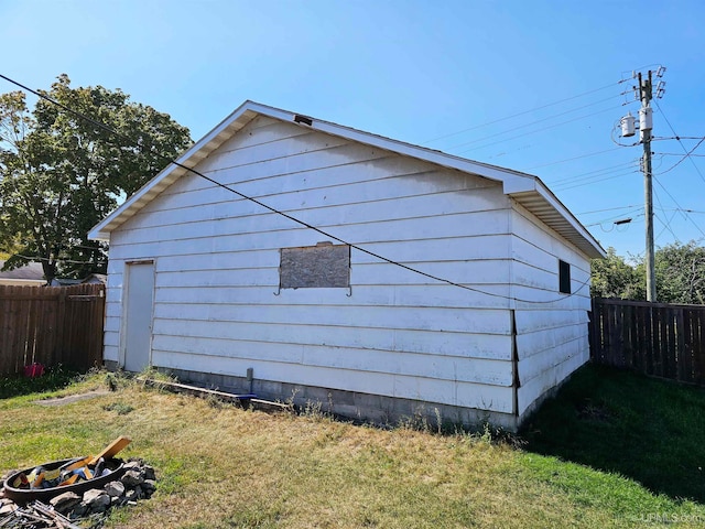 view of side of property featuring a yard