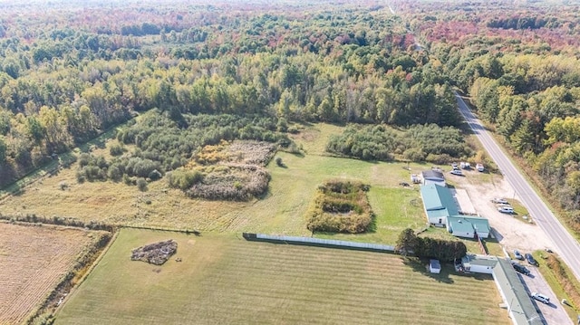 birds eye view of property with a rural view