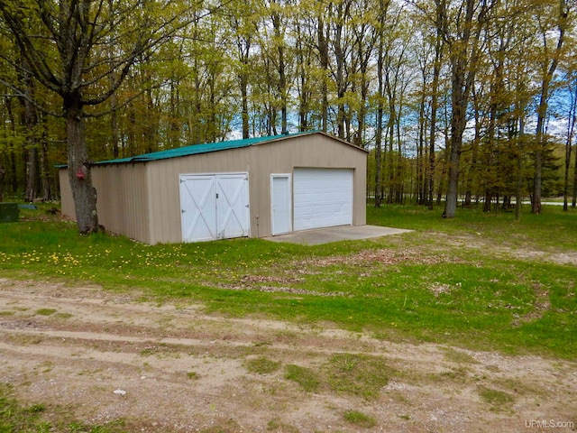 view of outdoor structure with a garage