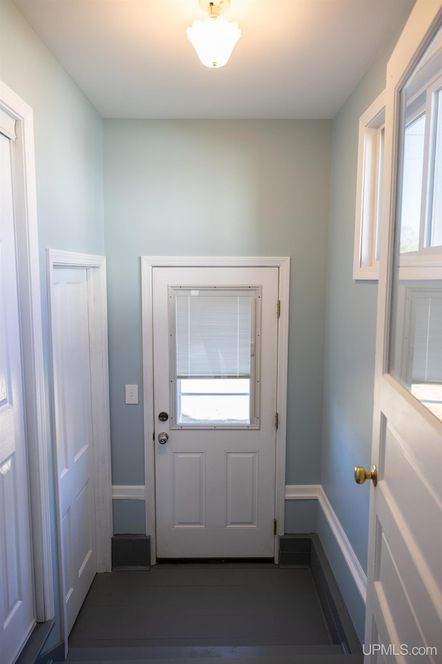 doorway to outside featuring plenty of natural light