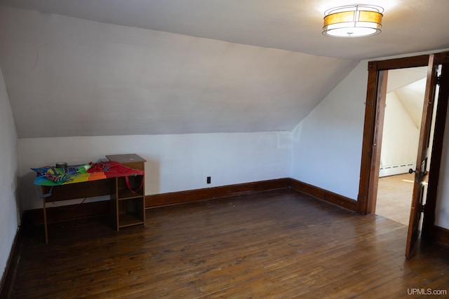 bonus room with baseboard heating, dark hardwood / wood-style floors, and vaulted ceiling