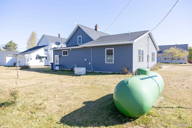 back of house with a yard