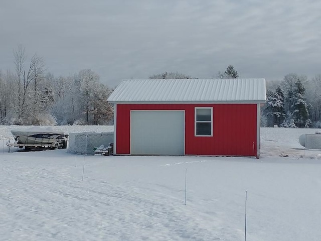 view of snow covered garage