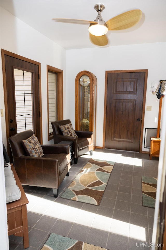 interior space featuring ceiling fan