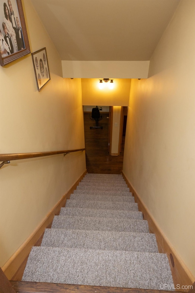 staircase featuring hardwood / wood-style flooring