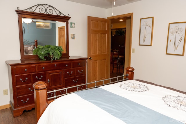 bedroom featuring dark wood-type flooring