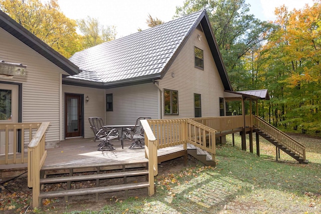 rear view of house with a wooden deck