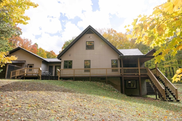 back of house featuring a deck