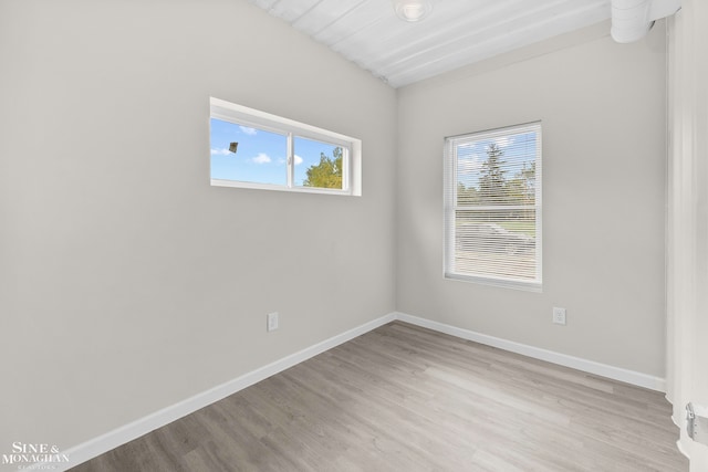 spare room featuring light wood-type flooring