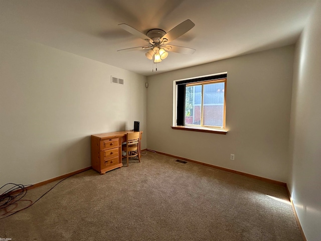 empty room with carpet flooring and ceiling fan