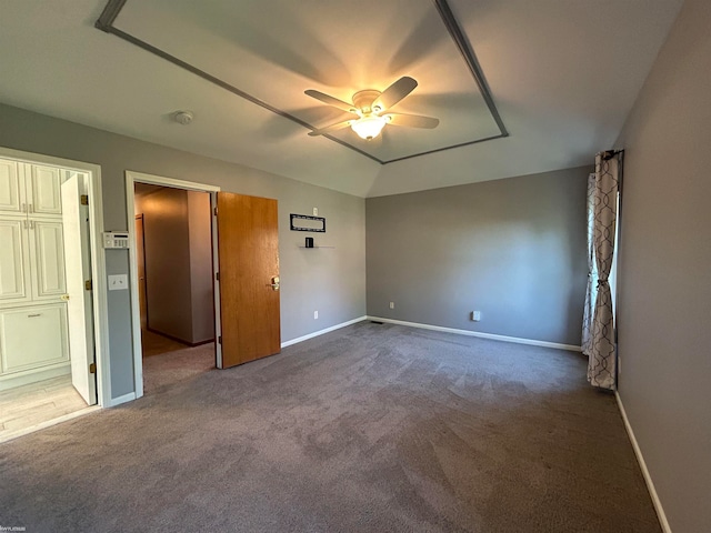 unfurnished bedroom with vaulted ceiling, carpet flooring, and ceiling fan