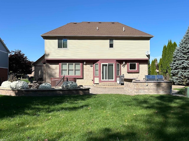 back of property with a patio and a yard