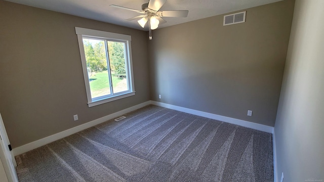 spare room with carpet flooring and ceiling fan