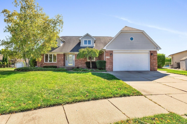 view of front of property with a front yard and a garage